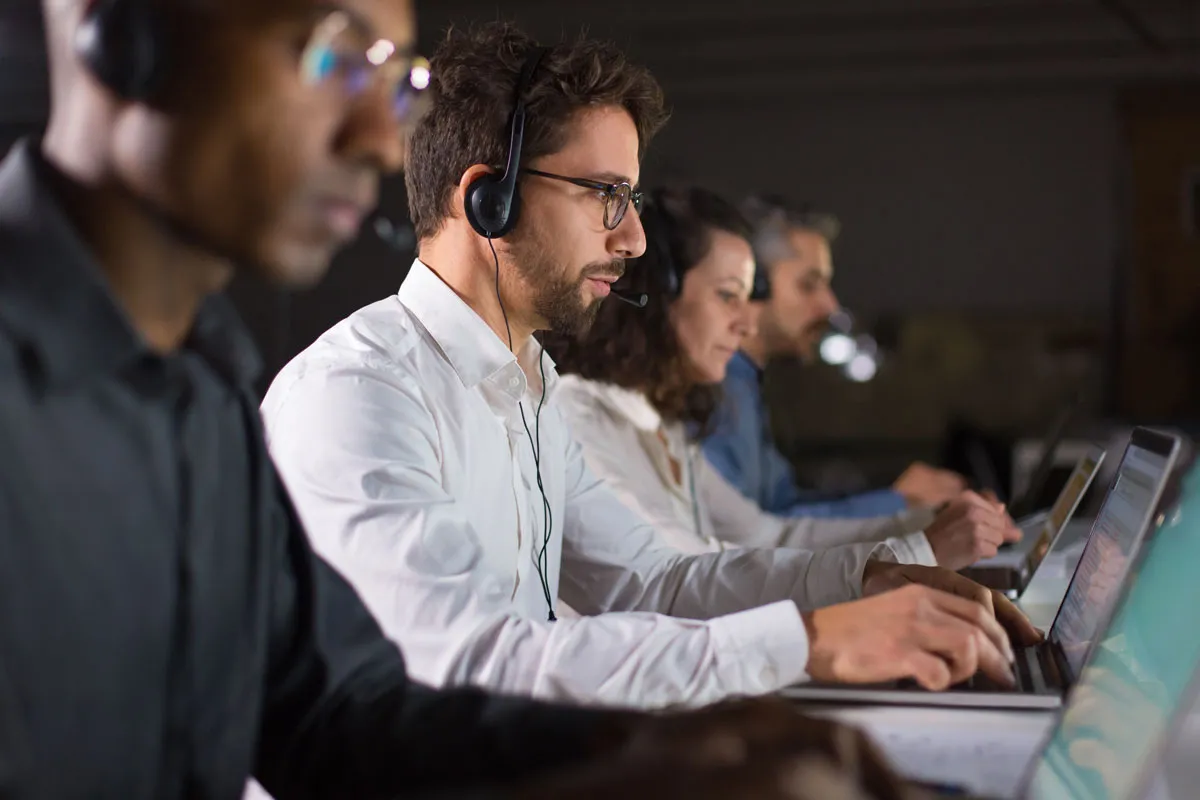 Call center scene, people taking calls Call center scene, people taking calls
