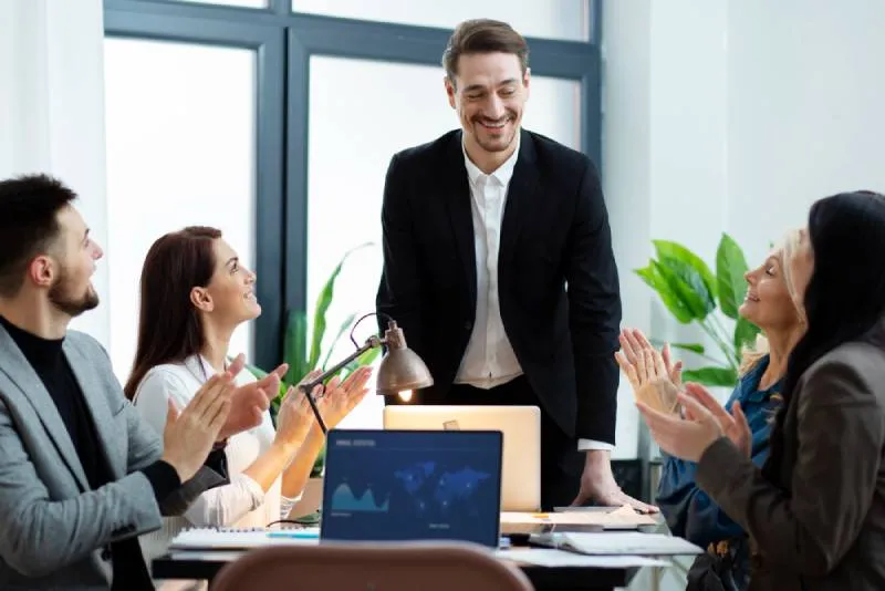 People cheering their success in a meeting