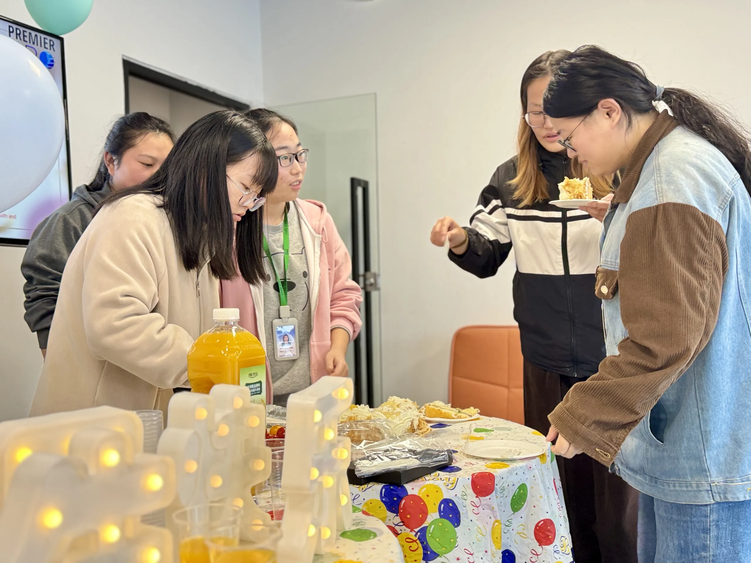 Business team in a meeting room, celebrating birthday