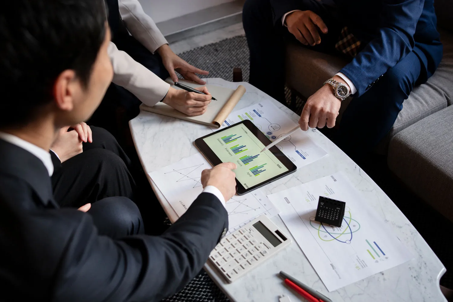 business-people-working-with-ipad-high-angle